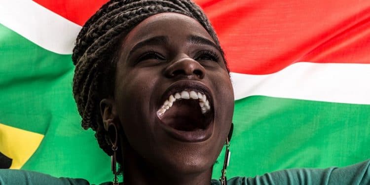 womends day August 2020 - womans face with the SA falg behind her