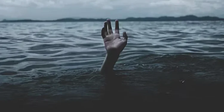 hand reaching out of water for help